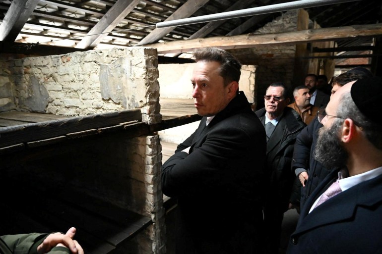 Elon Musk takes part in a private visit to Auschwitz-Birkenau with European Jewish Association (EJA) Chairman Rabbi Menachem Margolin, Ben Shapiro and Holocaust survivor Gidon Lev in Oswiecim, Poland January 22, 2024. European Jewish Association/Yoav Dudkevitch/Handout via REUTERS THIS IMAGE HAS BEEN SUPPLIED BY A THIRD PARTY. MANDATORY CREDIT NO RESALES. NO ARCHIVES