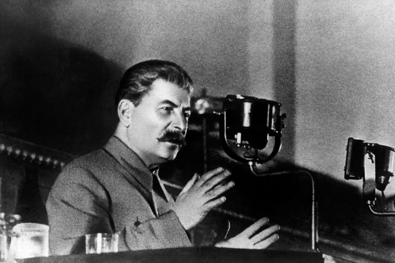 Soviet leader Joseph Stalin reports to the 8th All-Union Congress of Soviets on the draft Constitution of the USSR. (Photo by © Hulton-Deutsch Collection/CORBIS/Corbis via Getty Images)