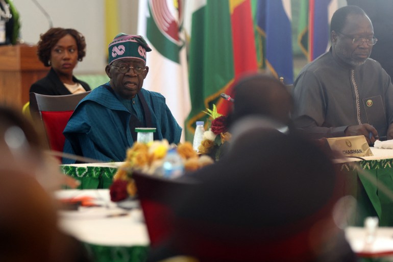 Nigerias President and Chairman, Economic Community of West African States Commission (ECOWAS) Bola Tinubu, looks on during the extraordinary session of Economic Community of West African States (ECOWAS) Heads of State and Government in Abuja, Nigeria on February 24, 2024. - Nigeria's president Bola Ahmed Tinubu urged worried West African leaders to rethink their strategy on coup-hit states at an emergency summit on Saturday. The region has been rocked by a series of political crises and Tinubu told heads of state gathered for the ECOWAS talks in Nigeria's capital Abuja they were meeting at a "critical juncture". (Photo by Kola Sulaimon / AFP)