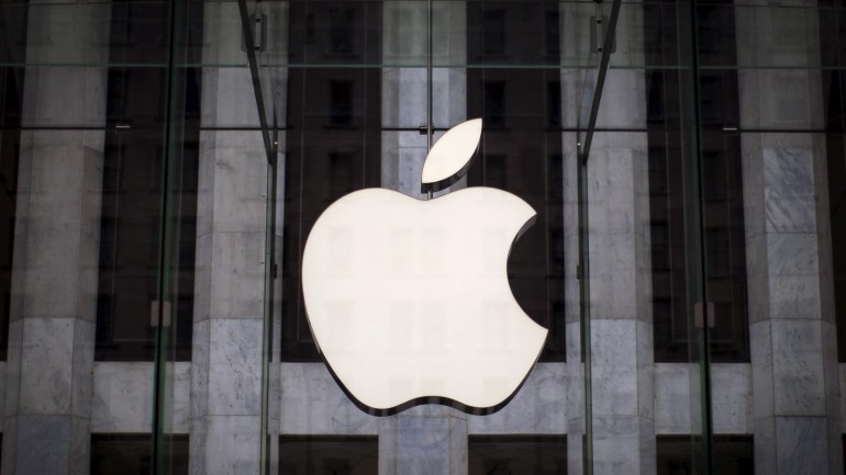 An Apple logo hangs above the entrance to the Apple store on 5th Avenue in New York City, in this file photo taken July 21, 2015. After months of declines in Apple's stock, sentiment appears to be mending as investors focus on steady earnings expectations and bet that the expected launch of a new iPhone will add badly-needed fuel to sputtering sales. REUTERS/Mike Segar/Files