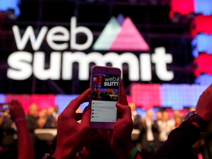 People take pictures during the Nasdaq Bell opening ceremony at Web Summit in Lisbon, Portugal November 9, 2016. REUTERS/Rafael Marchante