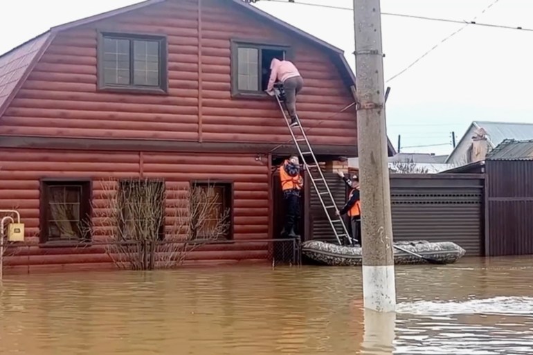 ORSK, RUSSIA - APRIL 6: (----EDITORIAL USE ONLY - MANDATORY CREDIT - 'RUSSIAN MINISTRY OF EMEGENCY SITUATIONS / HANDOUT' - NO MARKETING NO ADVERTISING CAMPAIGNS - DISTRIBUTED AS A SERVICE TO CLIENTS----) A screen grab captured from a video shows residents and pets are being evacuated collectively due to flooding after a dam burst in the city of Orsk, Russia on April 6, 2024. In the statement made by the Orsk Municipality, a large area in the region was flooded as a result of a large breach in the dam on the Ural River passing through the city. (Photo by Russian Ministry of Emergency/Anadolu via Getty Images)