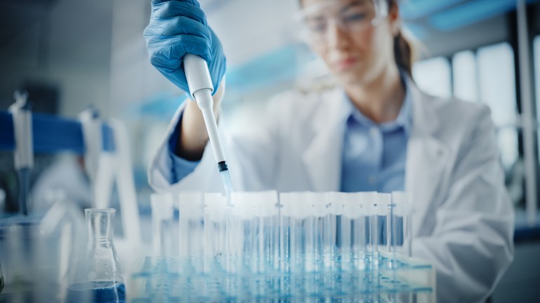 Medical Research Laboratory: Portrait of a Beautiful Female Scientist in Goggles Using Micro Pipette for Test ...