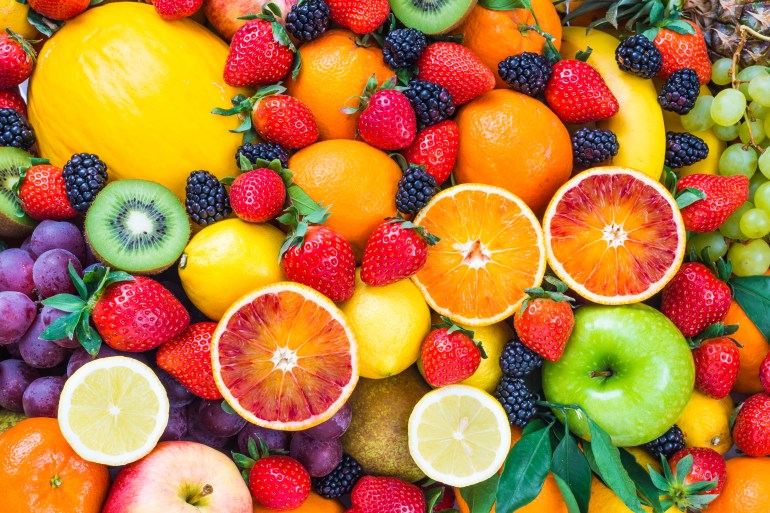 Fresh fruits assorted fruits colorful background.Vitamins natural nutrition concept.