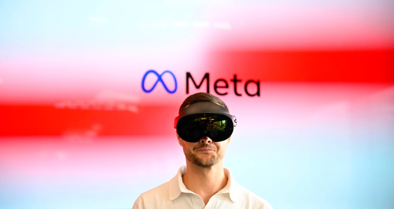 A volunteer wears virtual reality (VR) glasses during a launch event at the corporate offices of Meta in Berlin on June 6, 2023. (Photo by Tobias SCHWARZ / AFP)