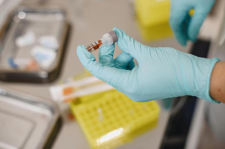 Laboratory Worker Holding a Test Tube