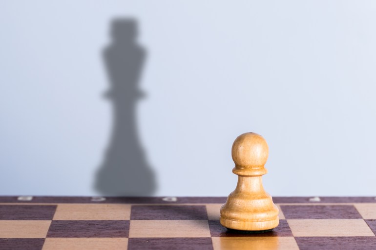 White chess pawn with king shadow. Hidden opportunities concept