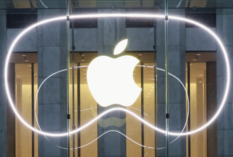 FILE PHOTO: A logo is pictured outside the Apple Fifth Avenue store as Apple's Vision Pro headset is presented there, in Manhattan in New York City, U.S., February 2, 2024. REUTERS/Brendan McDermid/File Photo