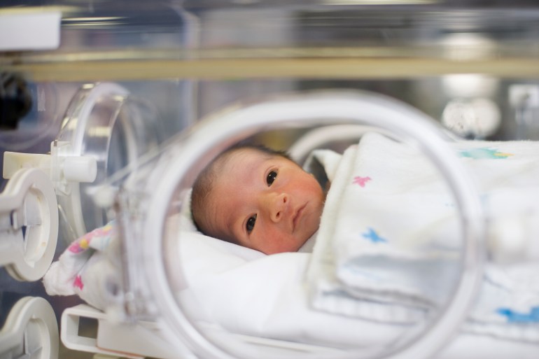 Hispanic baby in intensive care unit غيتي