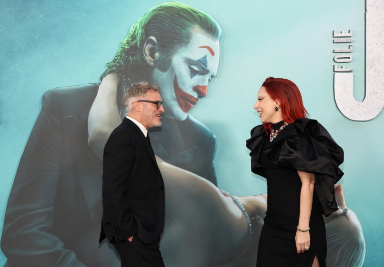 Cast members Joaquin Phoenix and Lady Gaga attend a premiere for the film"Joker: Folie a Deux", in Los Angeles, California, U.S., September 30, 2024. REUTERS/Mario Anzuoni