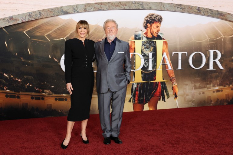 Director Ridley Scott and his wife Giannina Facio attend a premiere for the film 'Gladiator II', at TCL Chinese Theatre in Los Angeles, California, U.S., November 18, 2024. REUTERS/Mario Anzuoni